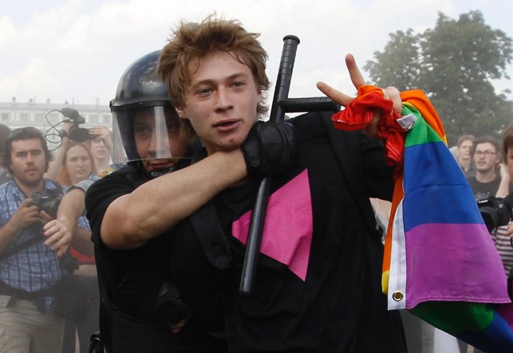 Police detain a gay rights activist during a Gay Pride event in St. Petersburg