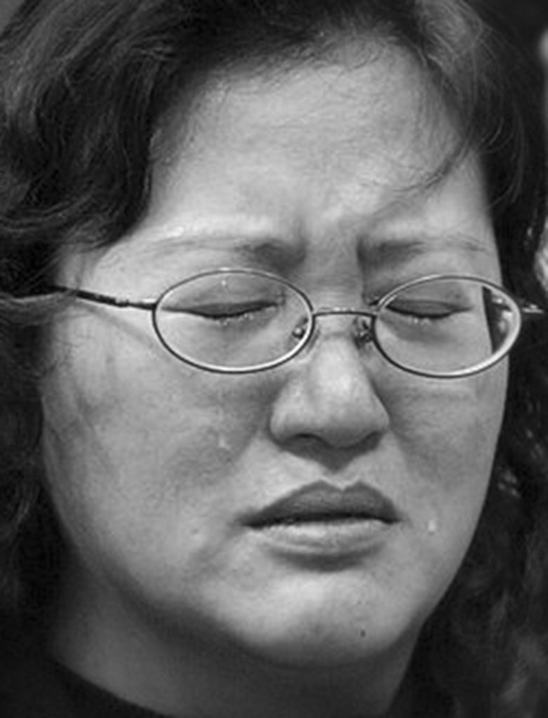 TAIPEI,TAIWAN-MARCH 19: A supporter of Taiwan President Chen Shui-bian shows her emotions outside Chen's election campaign headquarters in Taipei March 19, 2004. Taiwan President Chen Shui-bian survived an assassination attempt on Friday while campaigning on the eve of a presidential election he escaped and been released from the hospital with a bullet wound to the stomach. (photo by Paula Bronstein/Getty Images)